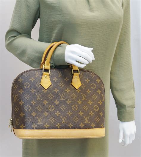 louis vuitton twist pm bag|louis vuitton alma bag monogram.